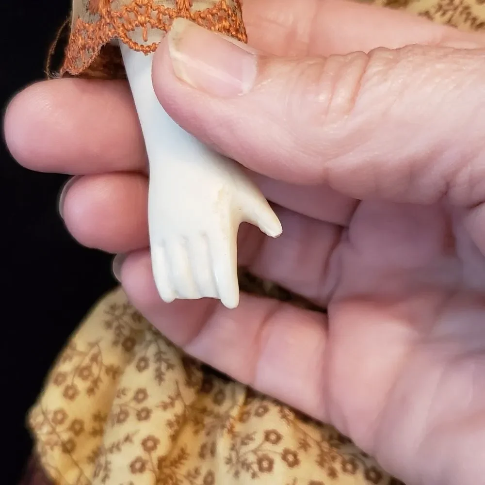 Vintage Porcelain Doll with Brown Dress and Hat